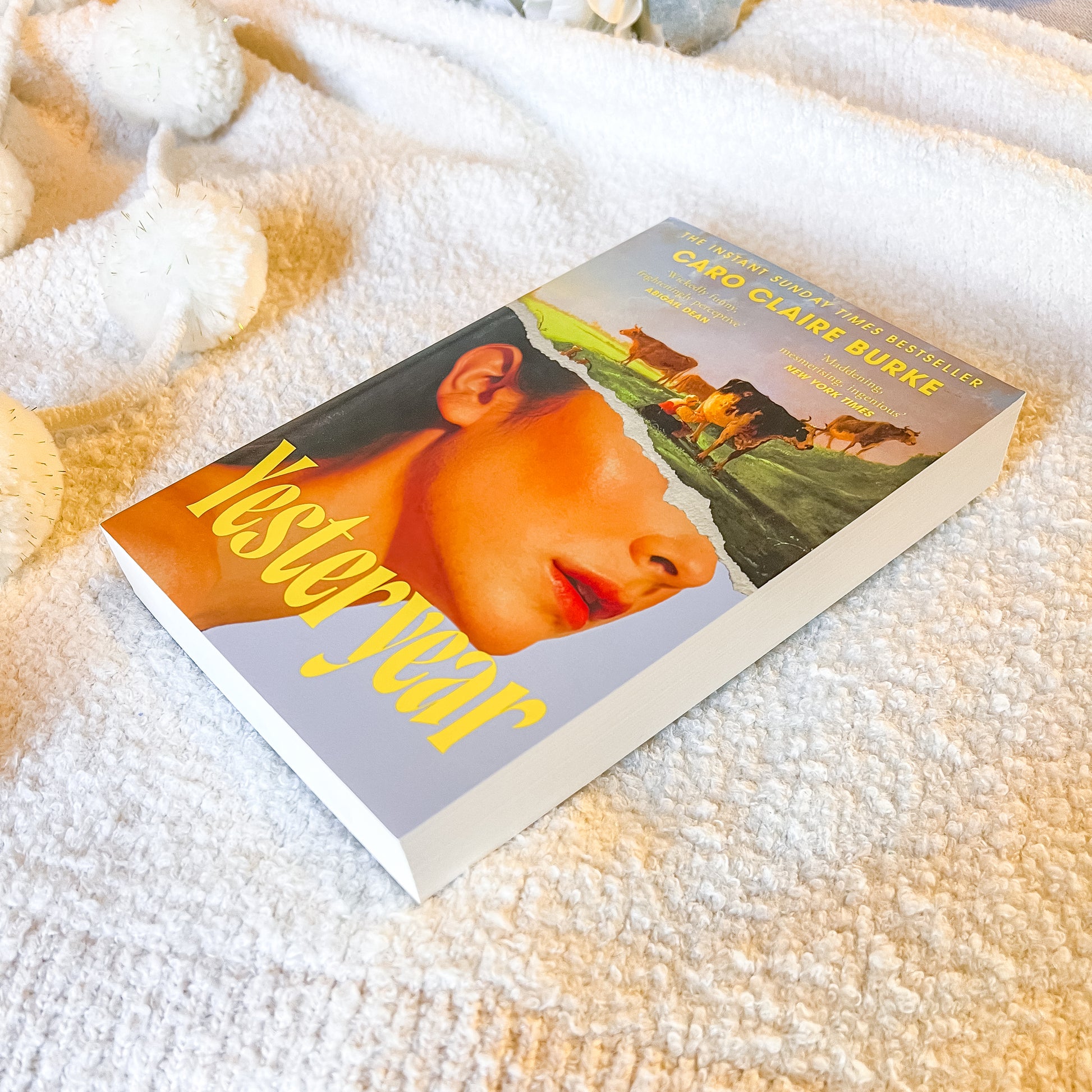 Book titled 'Yesteryear' by Caro Claire Burke on a textured surface