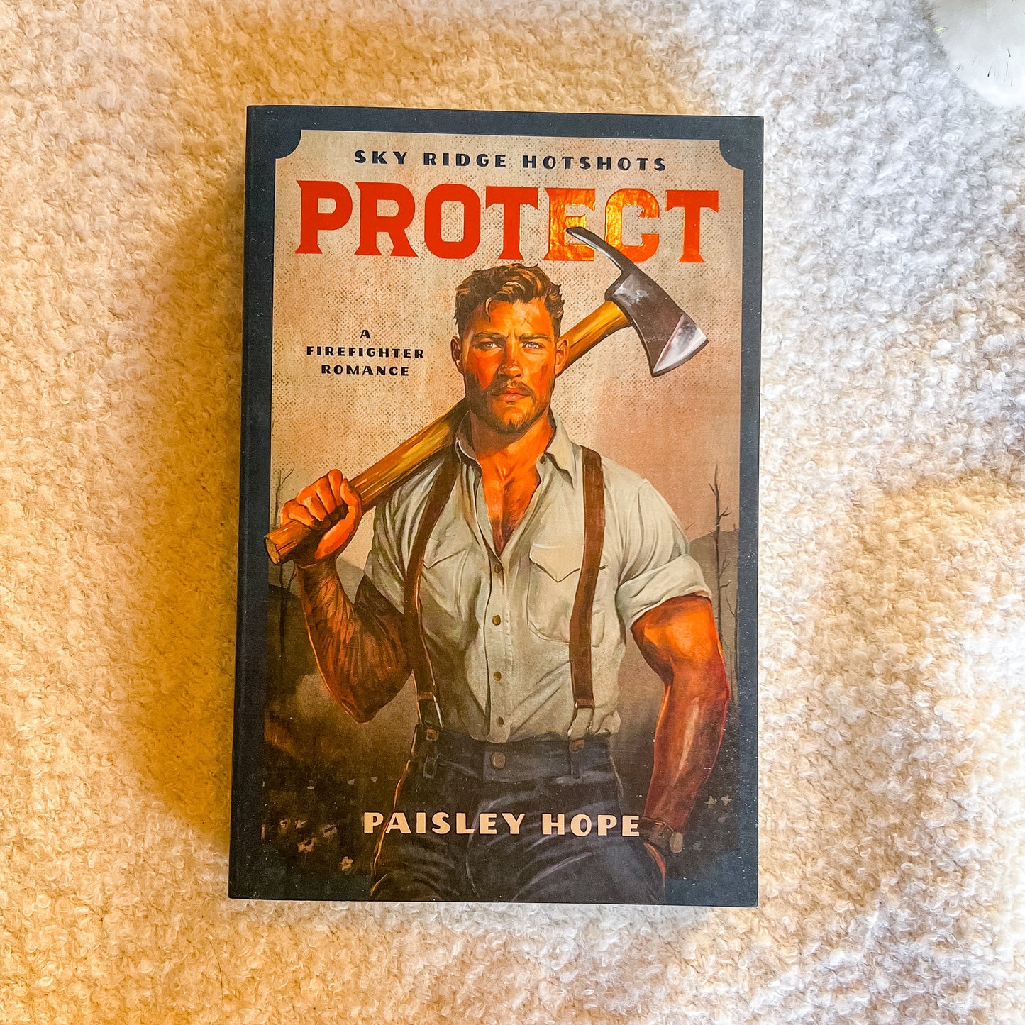 Book cover of 'Protect' by Paisley Hope featuring a firefighter holding an axe on a textured surface.