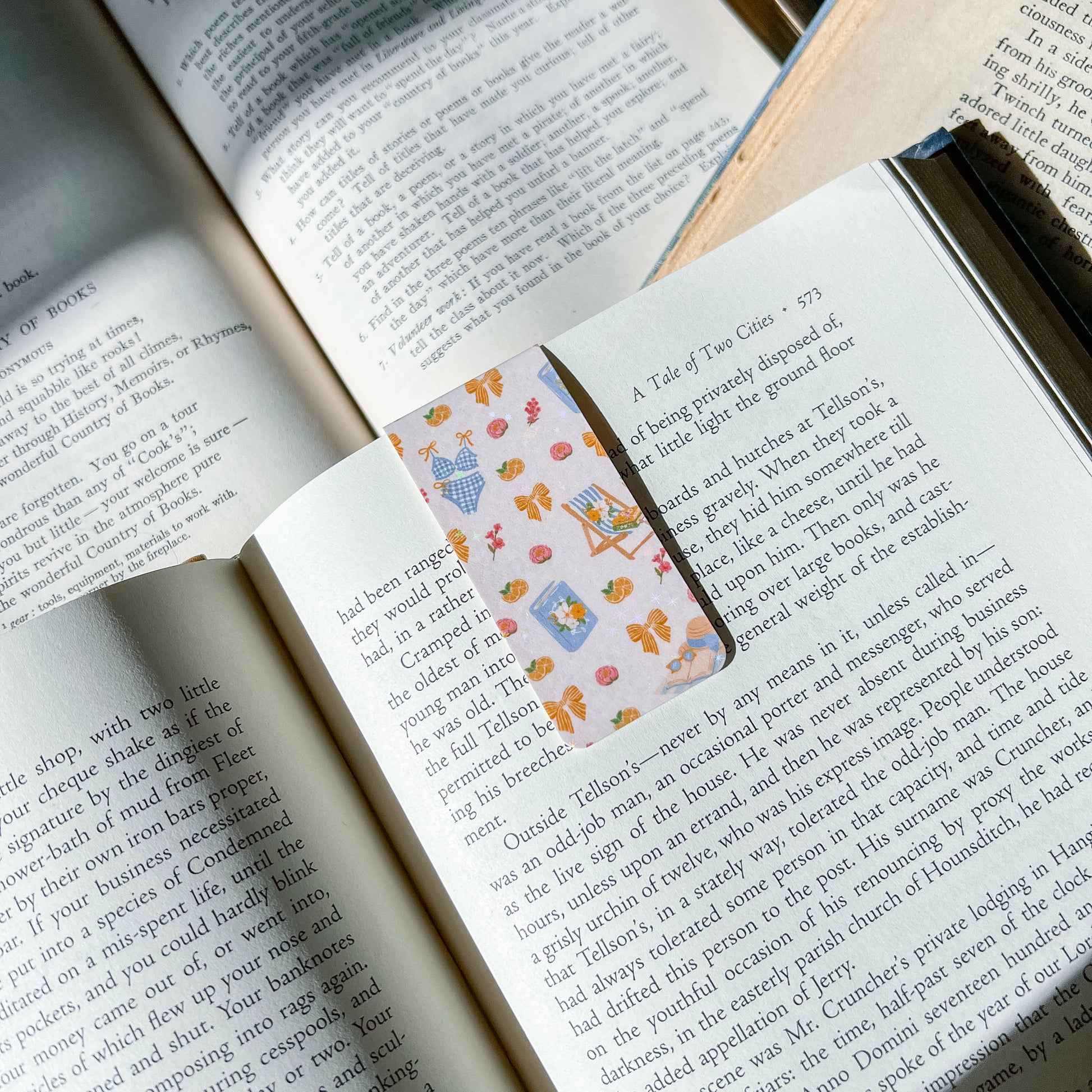 Open book with a decorative bookmark featuring cartoon characters.