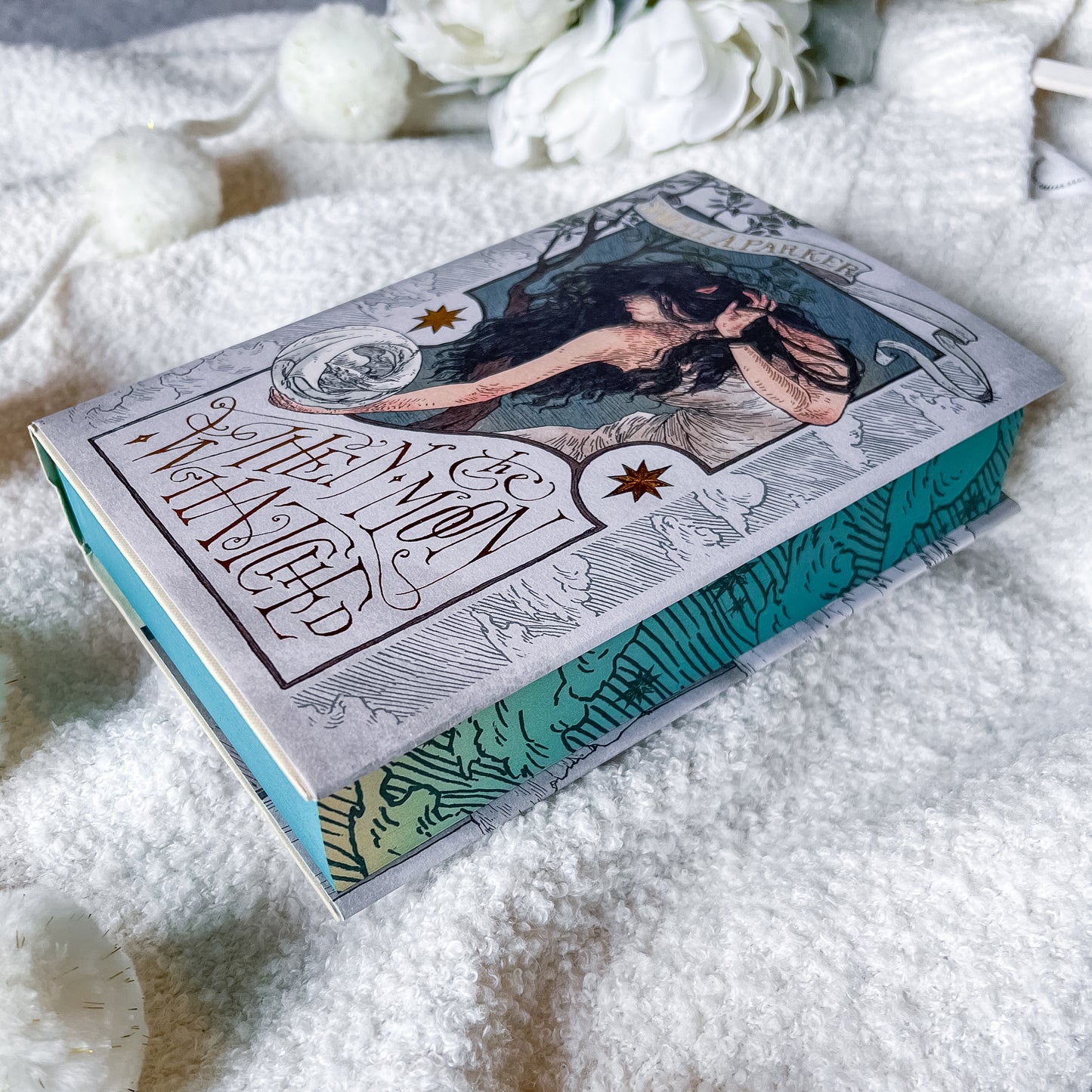 Book titled 'When Moon Hatched' by Sarah A. Parker on a textured white surface.