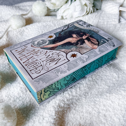 Book titled 'When Moon Hatched' by Sarah A. Parker on a textured white surface.