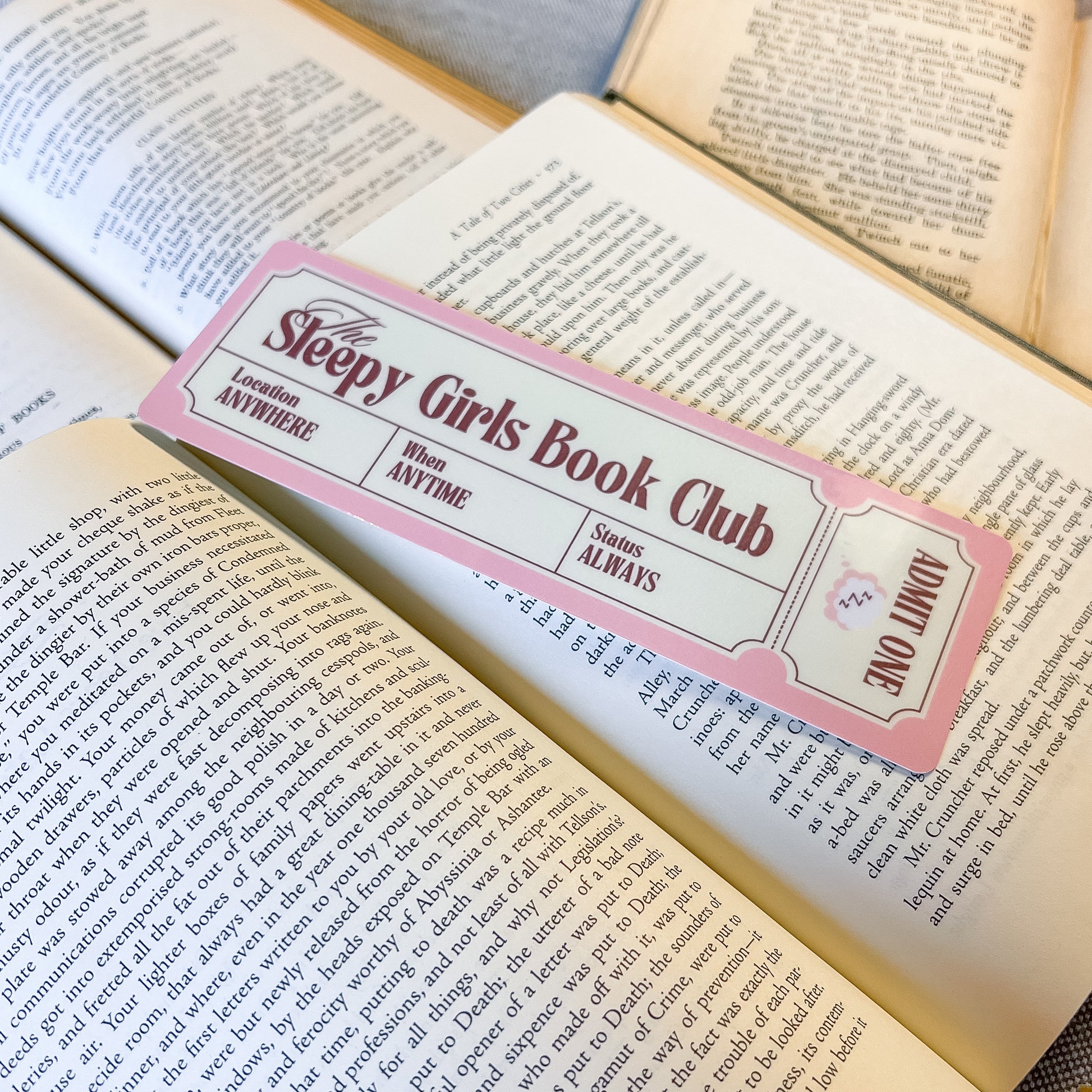 Book club invitation card on an open book