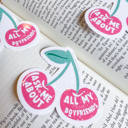 Stickers with text 'All My Boyfriends' and 'Ask Me About' on a book page.