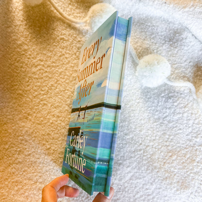 Book titled 'Every Summer After' by Carley Fortune held against a textured white and beige background.
