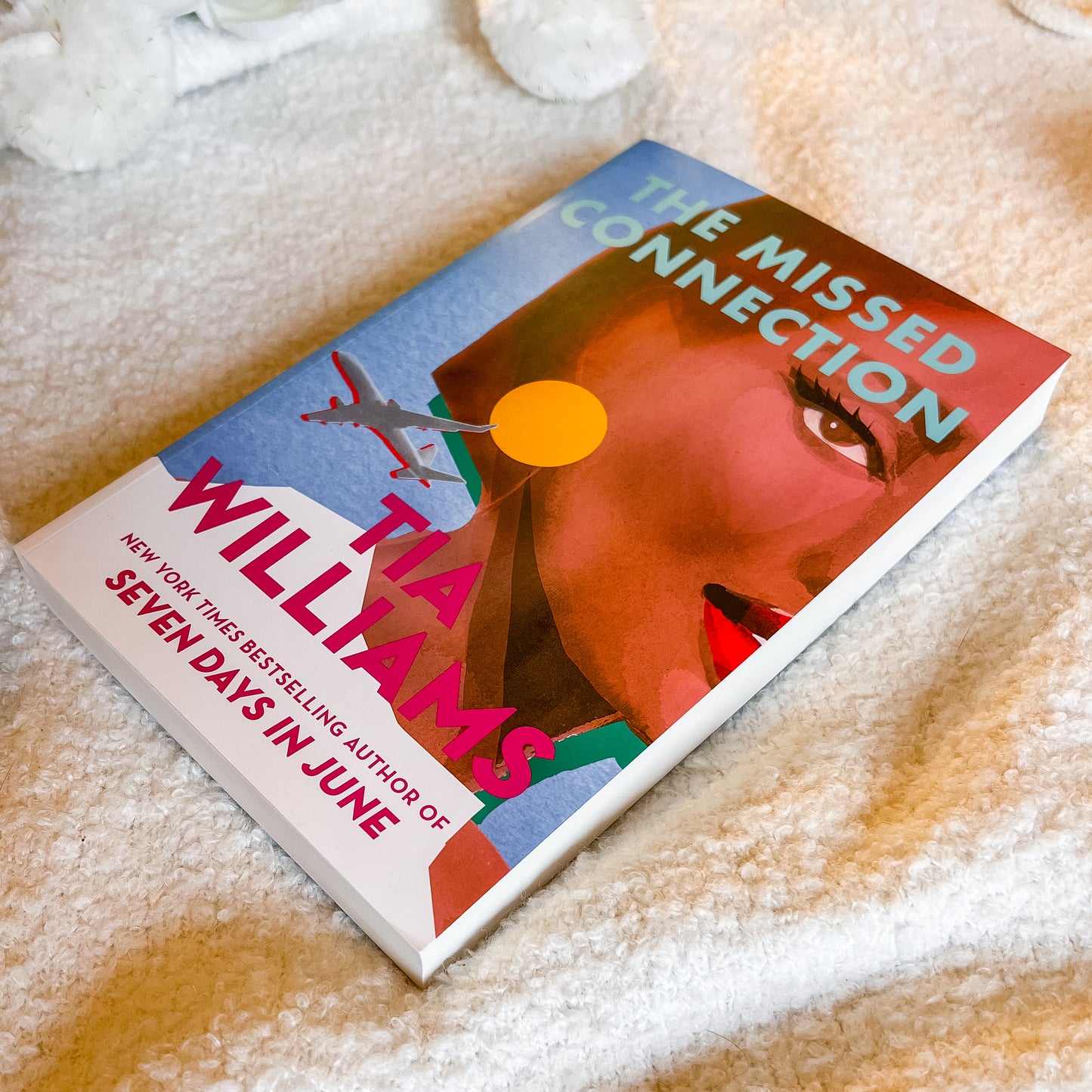 Book titled 'The Missed Connection' by Williams on a textured surface