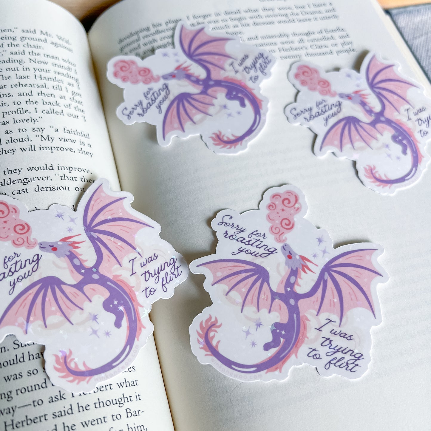 Dragon-shaped stickers with text on a book page