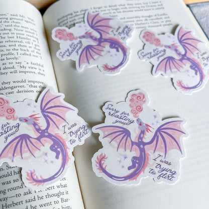 Dragon-shaped stickers with text on a book page