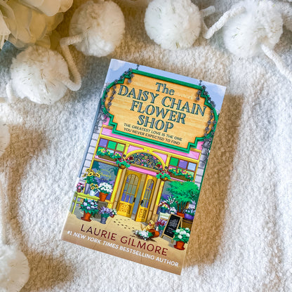 Book "the daisy chain flower shop" on a textured white background