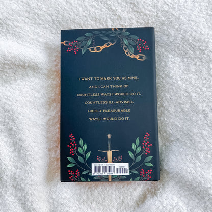 Book cover with decorative elements and text on a textured surface