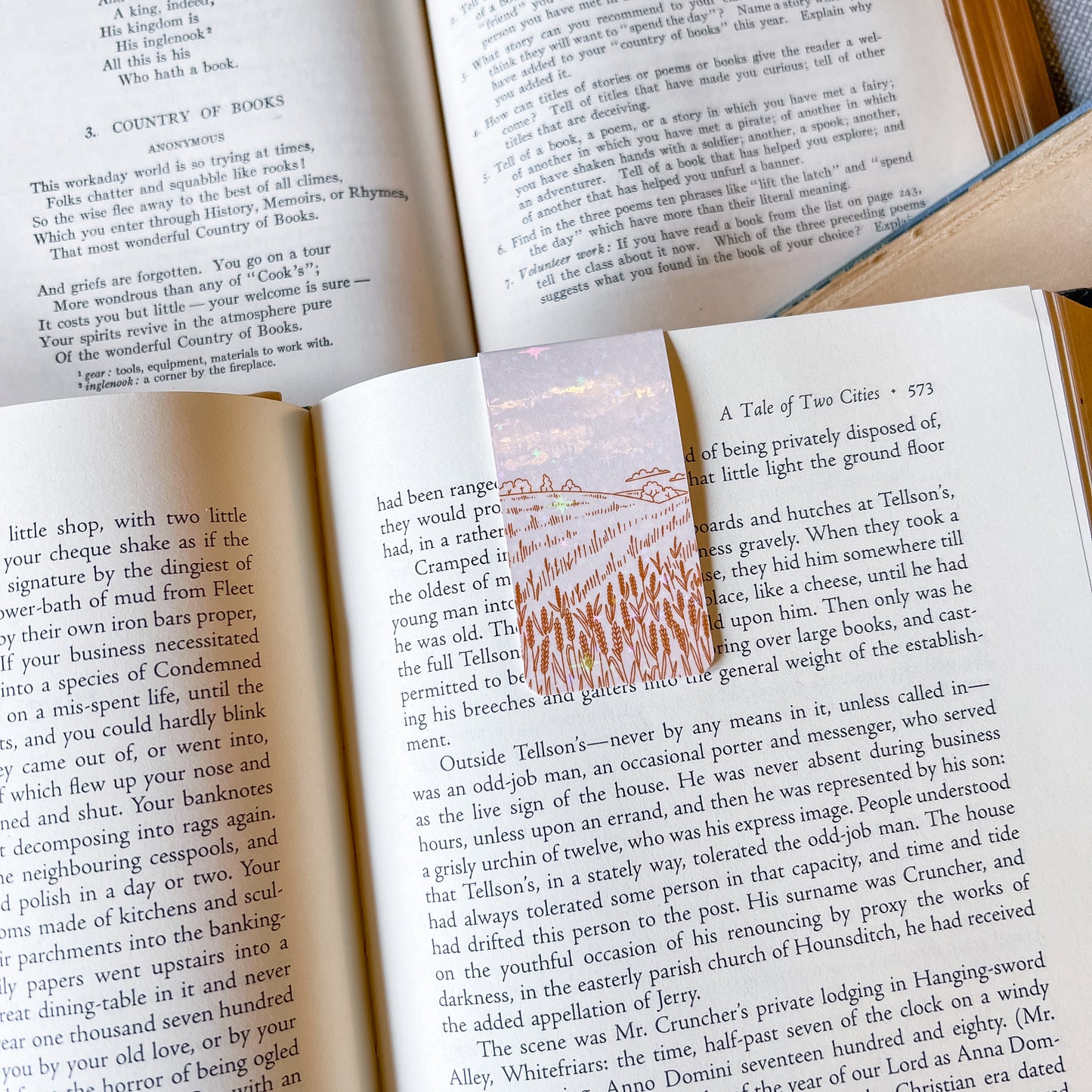 Open book with a decorative bookmark featuring a floral design.