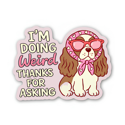 Sticker with a dog wearing sunglasses and a bandana, with text 'I'm doing weird thanks for asking' on a white background.