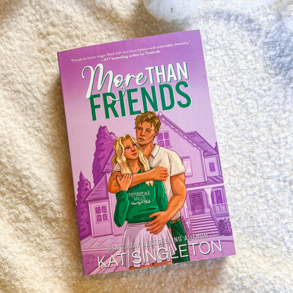 Book titled 'More Than Friends' by Kats Singleton on a textured surface