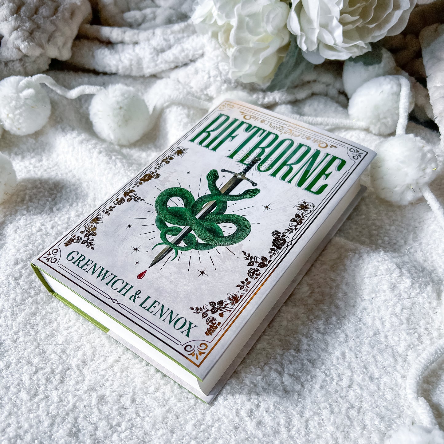 Riftborne book on a white textured surface.
