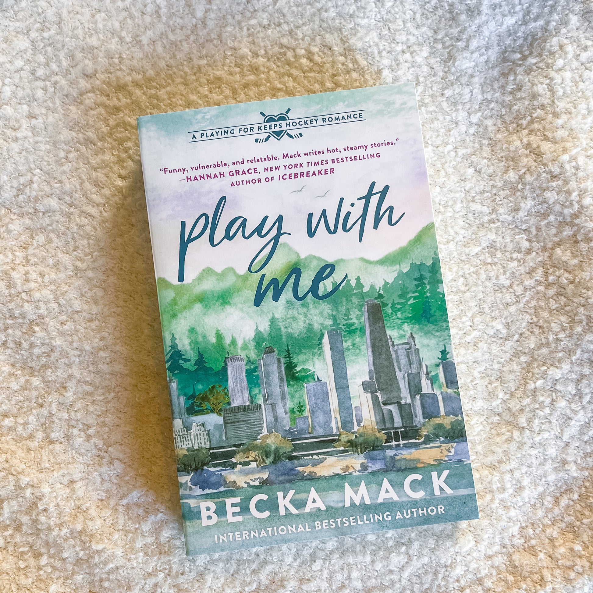 Book titled 'Play with Me' by Becka Mack on a textured surface