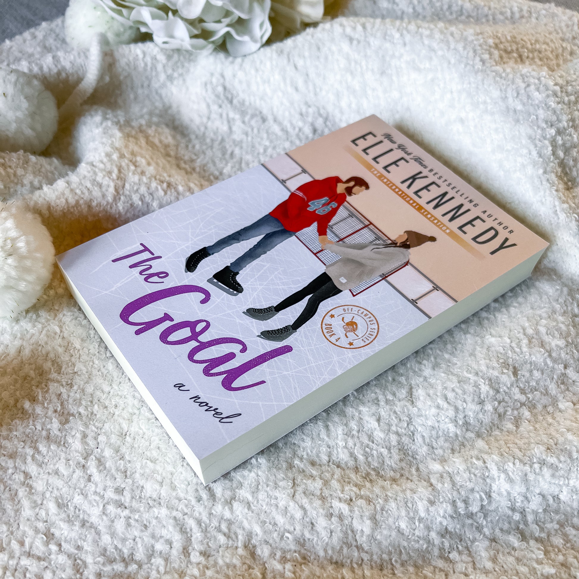 Book titled 'The Goal' by Elle Kennedy on a soft blanket