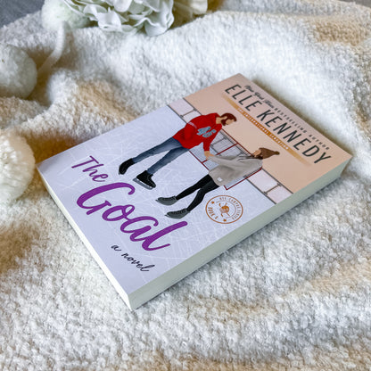 Book titled 'The Goal' by Elle Kennedy on a soft blanket