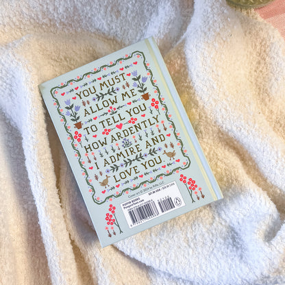 Book with decorative cover on a soft fabric background