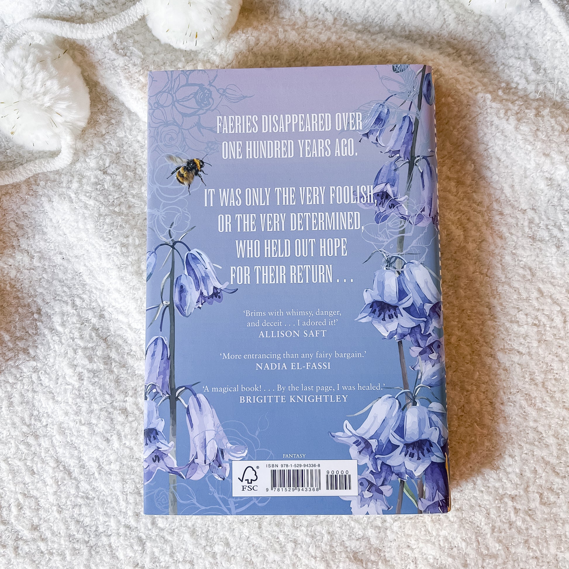 Book cover with floral design and text on a textured surface