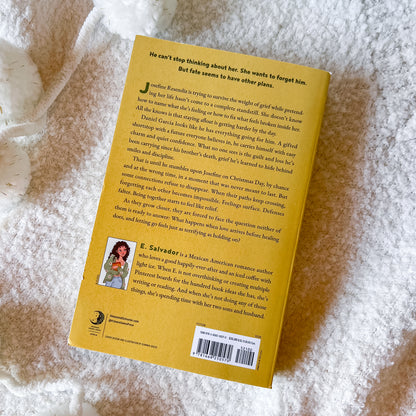 The back cover of 'Please Don't Go' by E. Salvador on a white background
