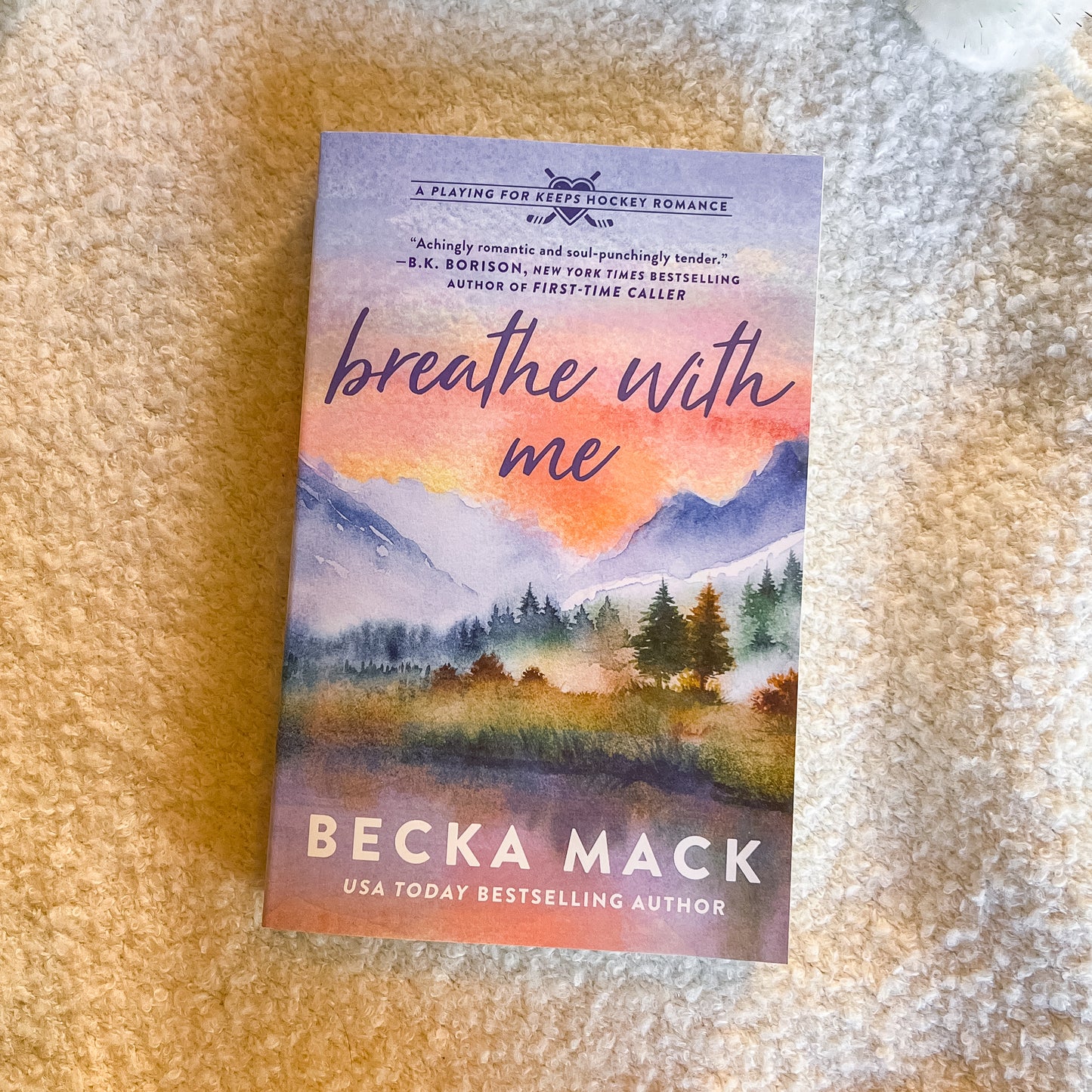 Book titled 'Breathe with Me' by Becka Mack on a textured surface