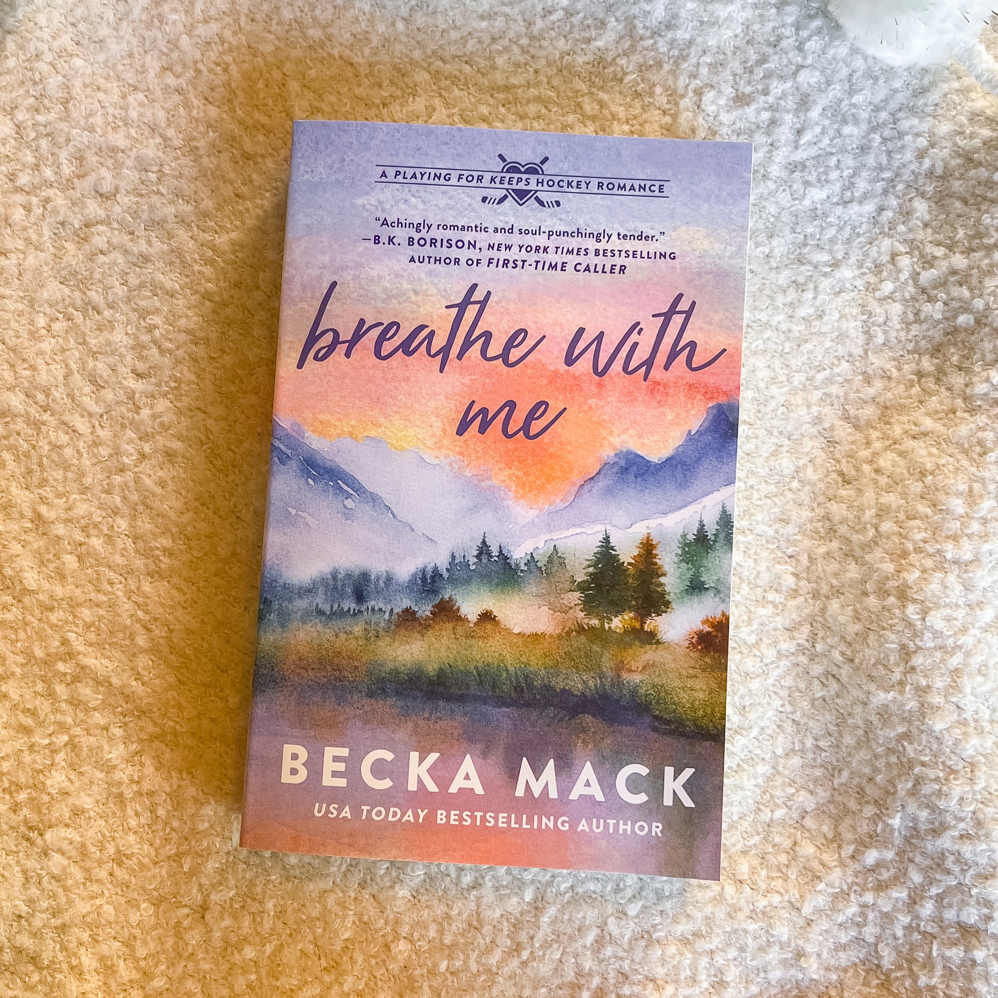 Book titled 'Breathe with Me' by Becka Mack on a textured surface