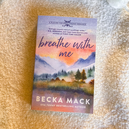 Book titled 'Breathe with Me' by Becka Mack on a textured surface