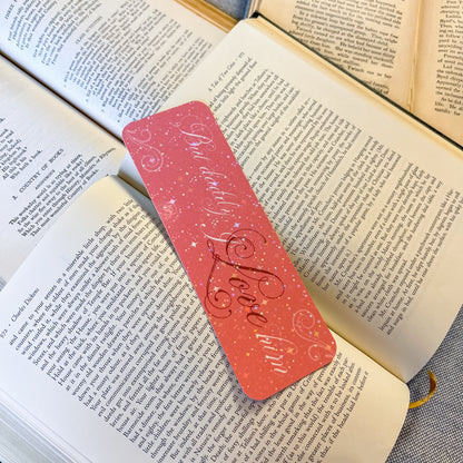 Pink bookmark with 'Beloved Love' text on an open book
