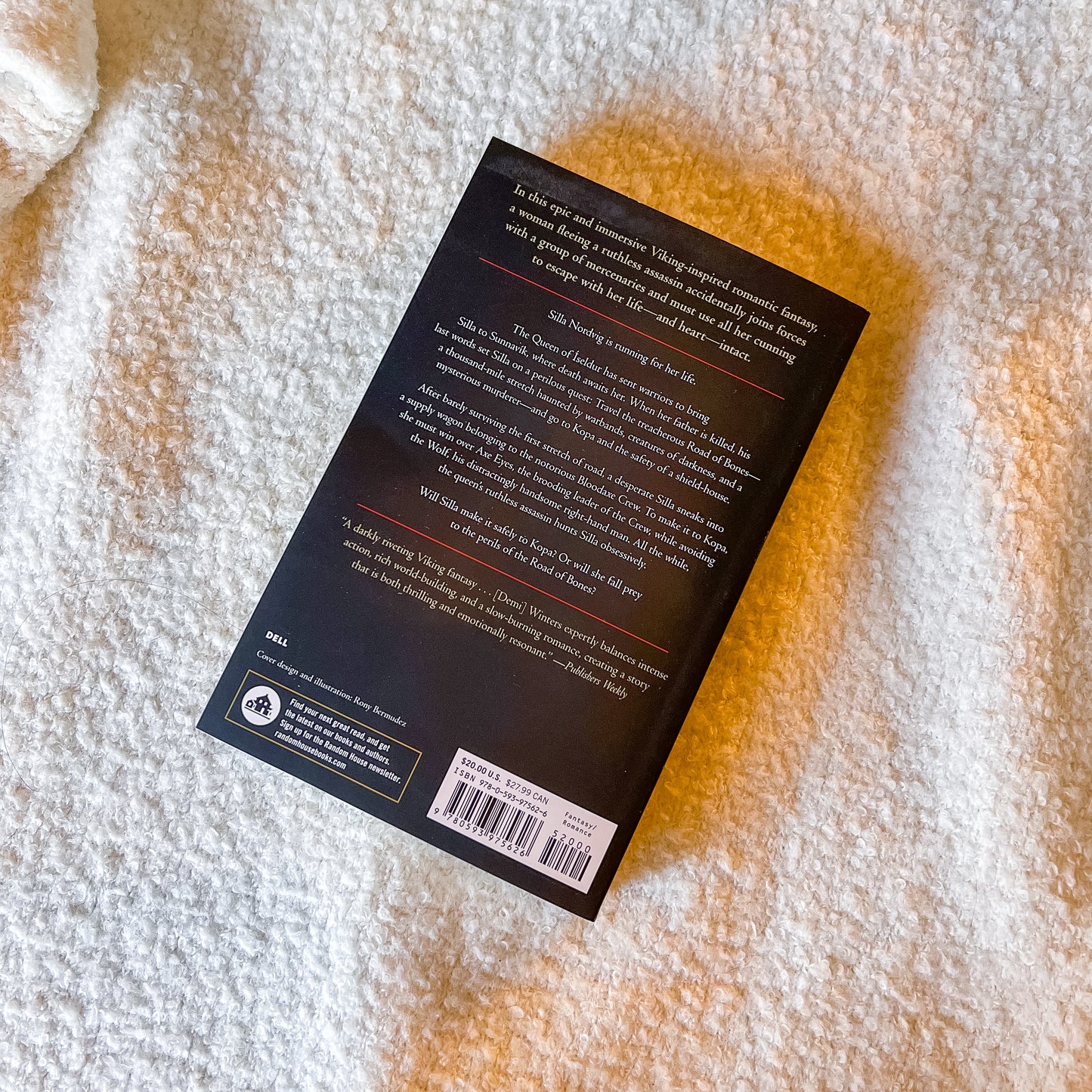 Book back cover with text and barcode on a textured surface