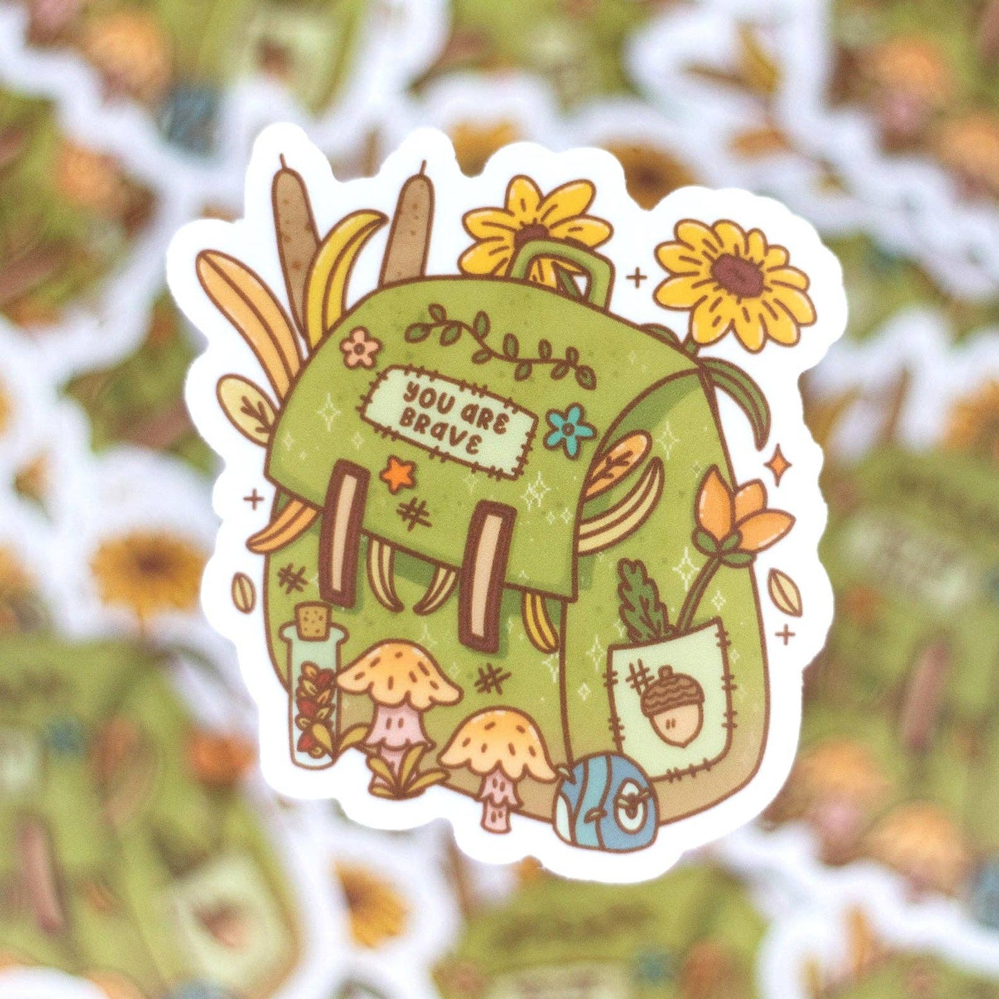 Decorative sticker with a green backpack, flowers, and text on a floral background