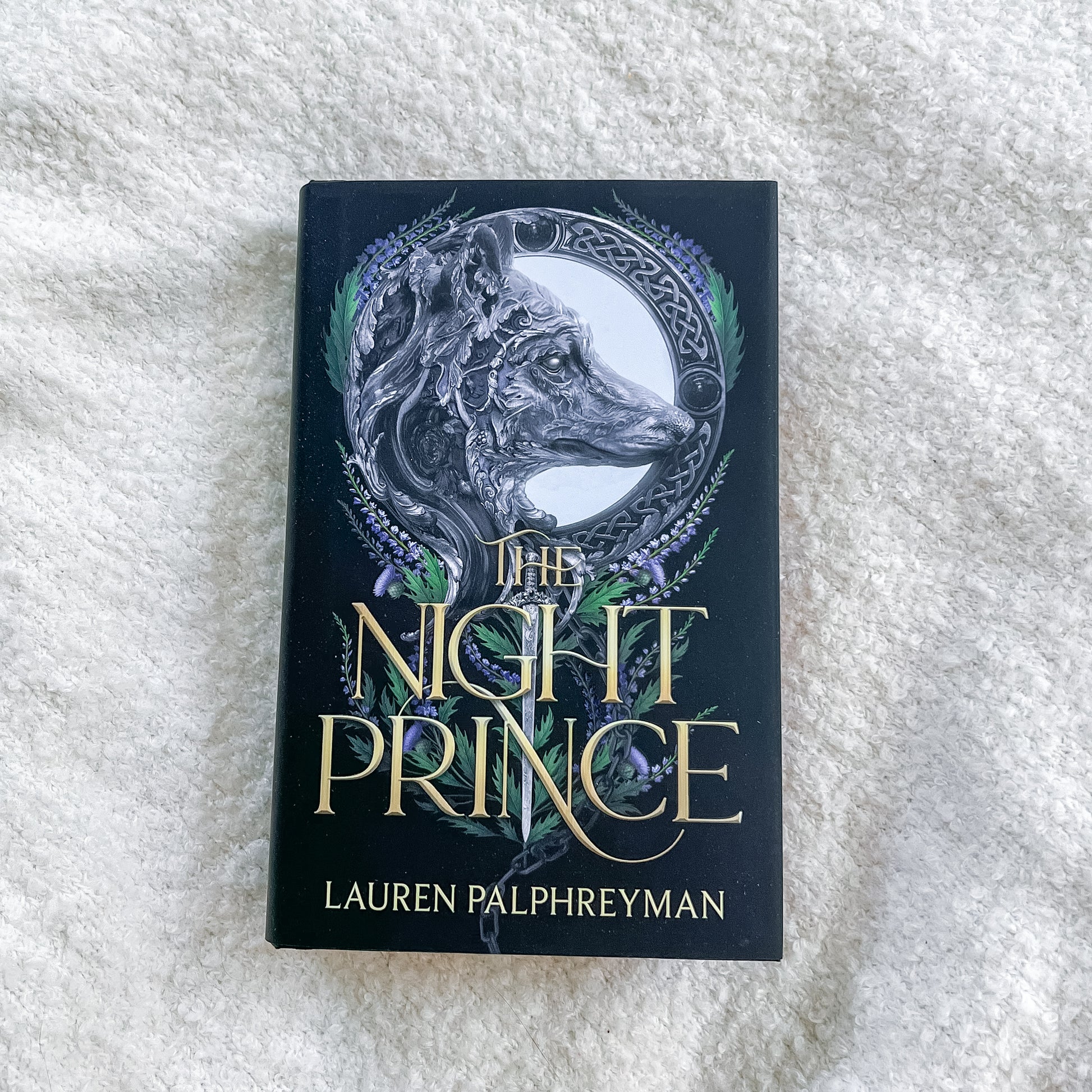 Book titled 'The Night Prince' by Lauren Palphreyman on a textured white surface