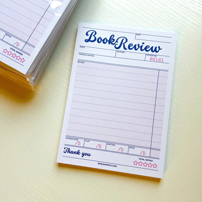 Book review notepad on a light surface