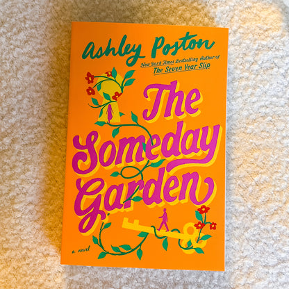 Book cover of 'The Someday Garden' by Ashley Poston on a textured surface