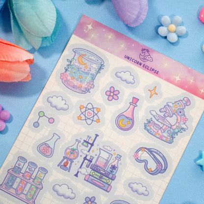 Sheet of colorful stickers with various designs on a blue background with decorative items.