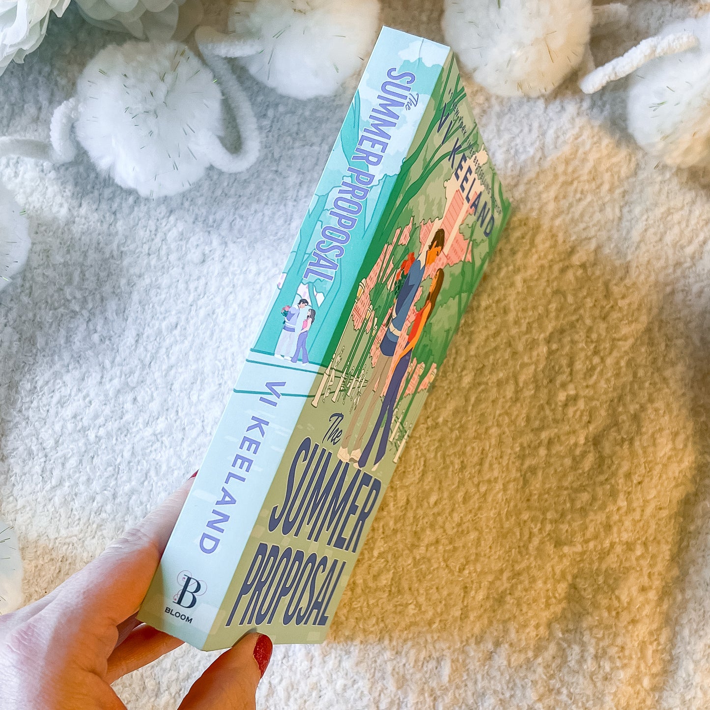 "The summer proposal" by Vi Keeland book spine on a soft white background.