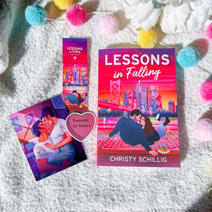 Book cover of 'Lessons in Falling' by Christy Schillig with a romantic illustration on a white background and product packaging