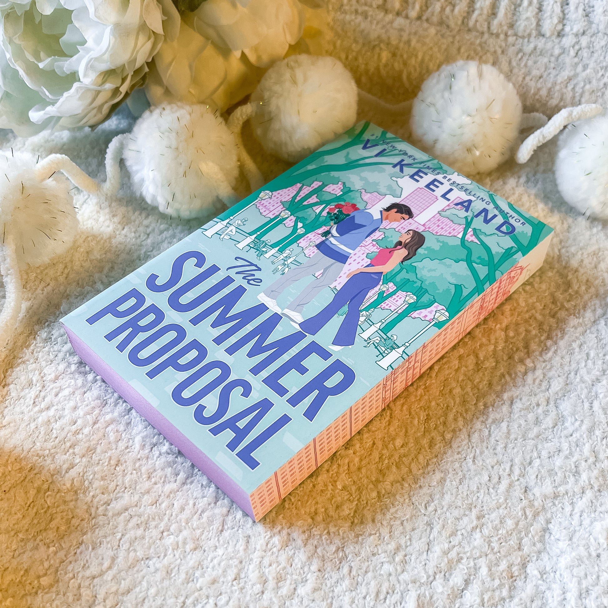 "The summer proposal" by Vi Keeland book on a soft white background.