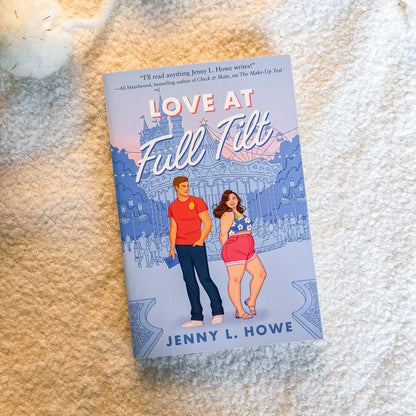 The book cover of 'Love At Full Tilt' by Jenny L. Howe is shown flat on a textured cream-colored blanket.