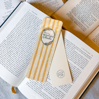 Decorative bookmark on an open book with visible text