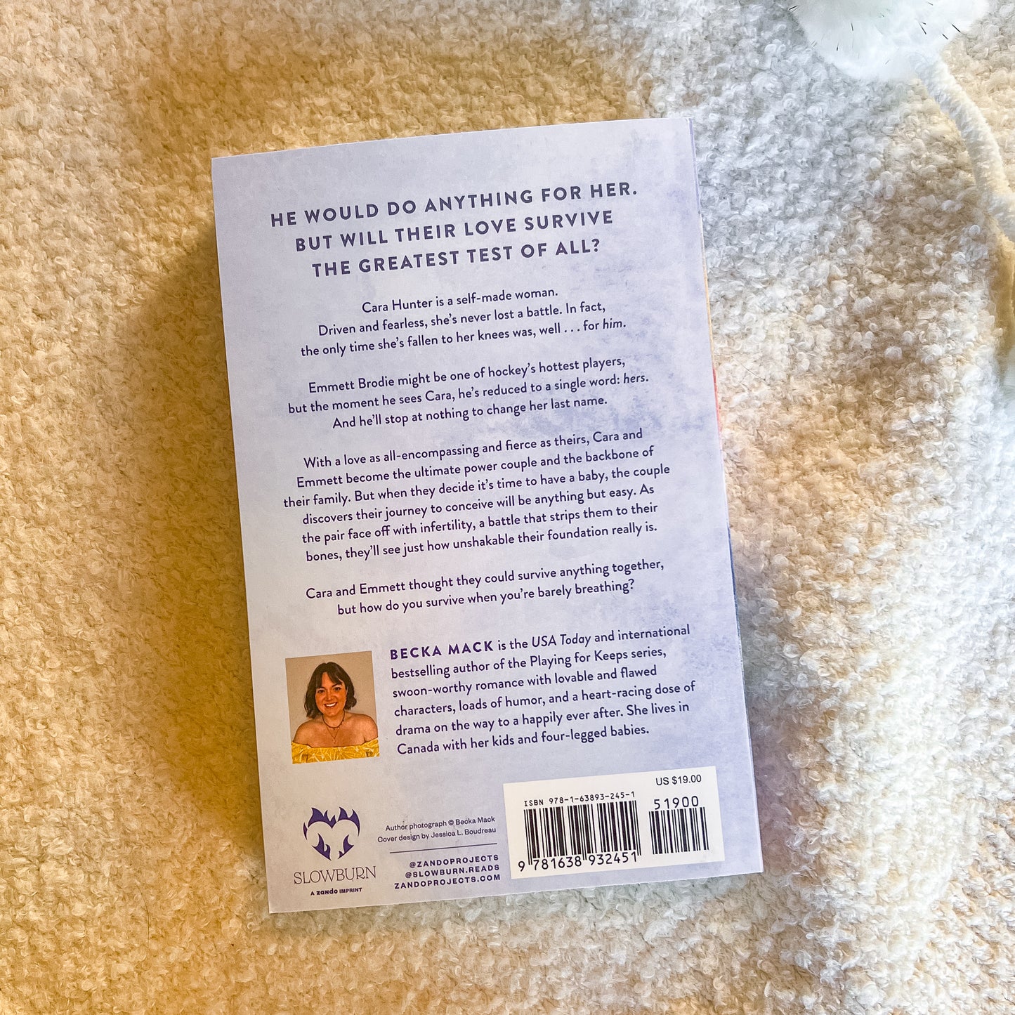 Book back cover with text and a barcode on a textured surface