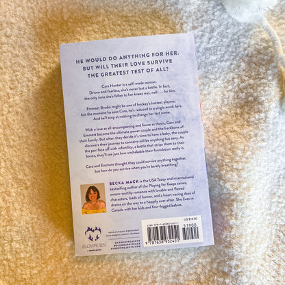 Book back cover with text and a barcode on a textured surface