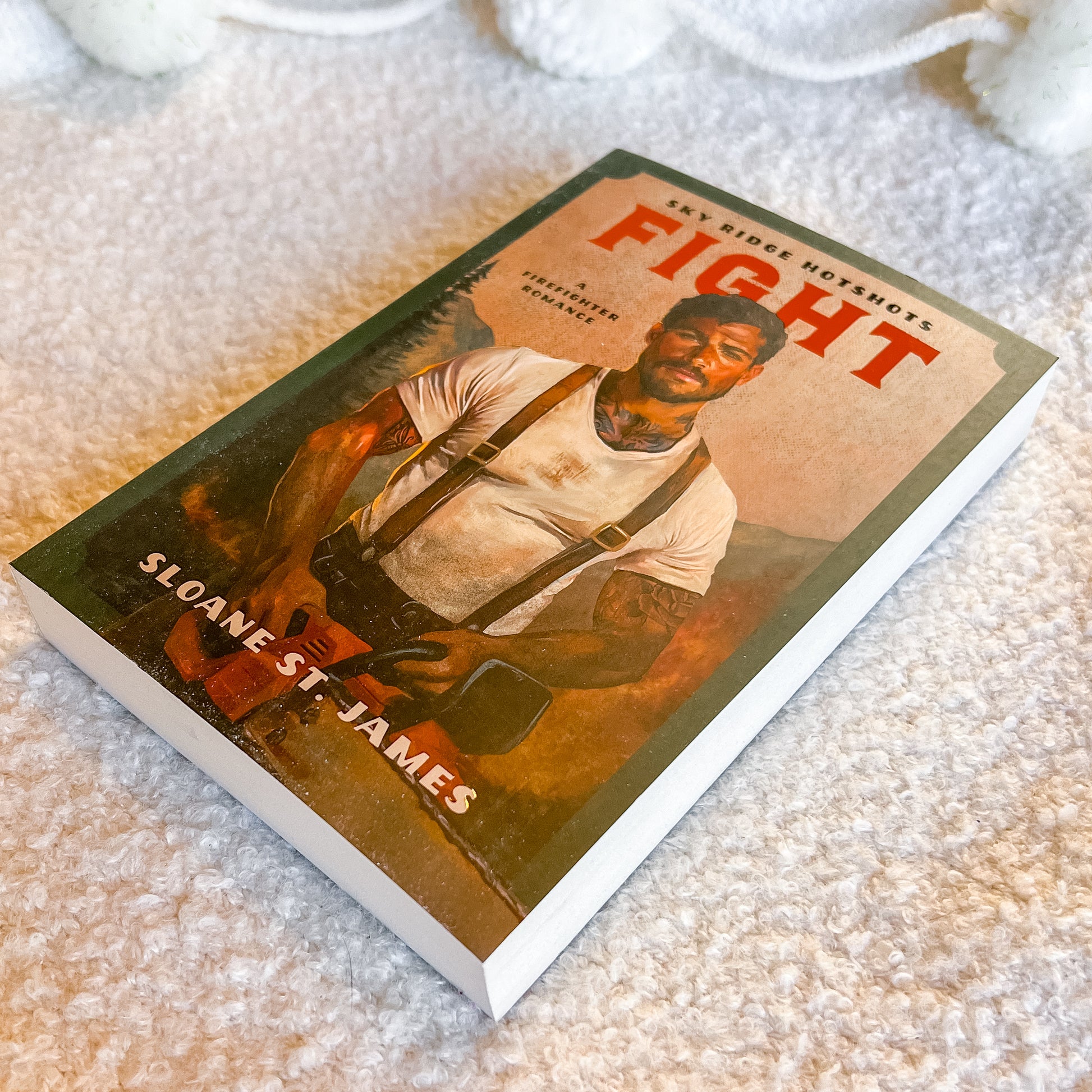 Book titled 'Fight' by Sloane St. James on a textured surface