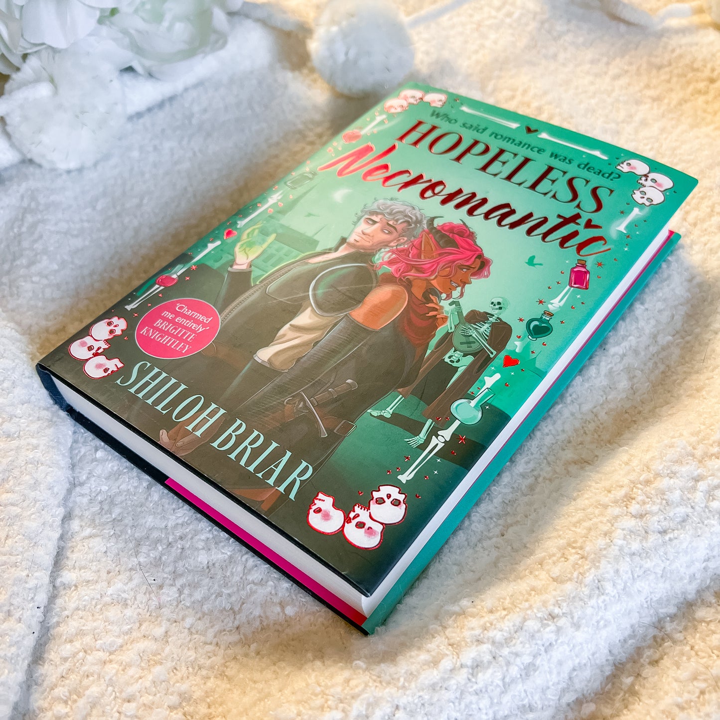 Book titled 'Hopeless Neromantic' by Shiloh Briar on a soft surface