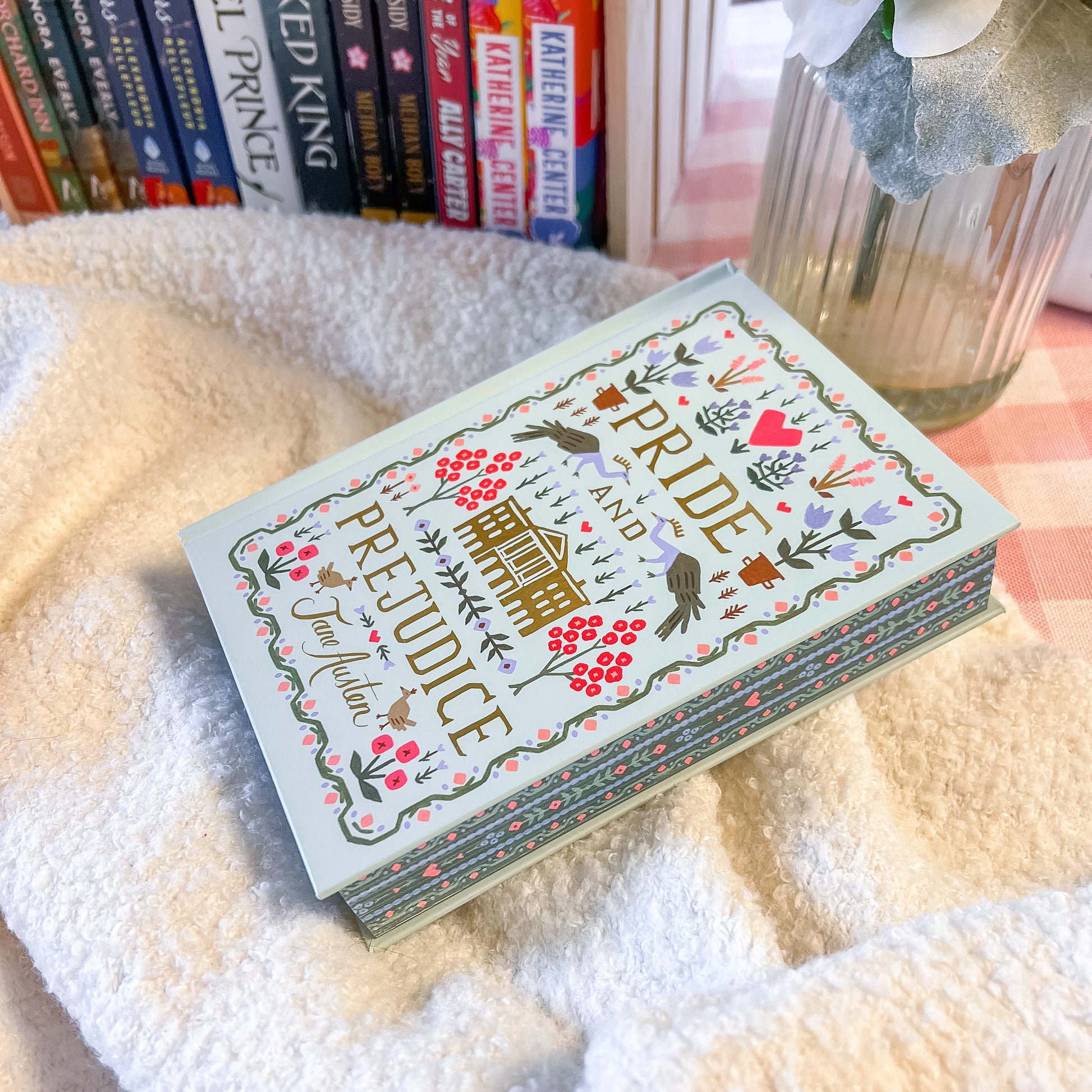 Book titled 'Pride and Prejudice' with decorative cover on a soft surface