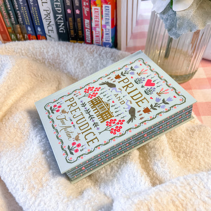 Book titled 'Pride and Prejudice' with decorative cover on a soft surface