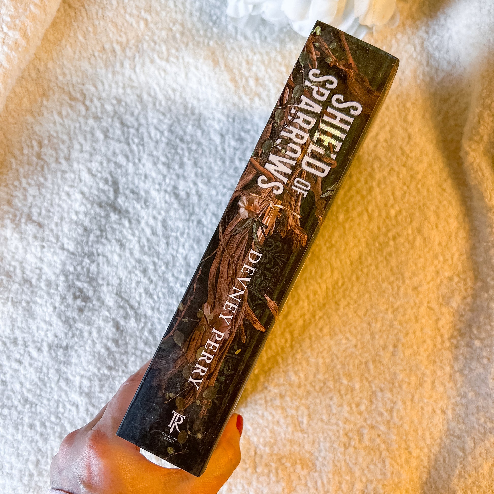 Spine of the book "Rites of the Starling" on a soft white background