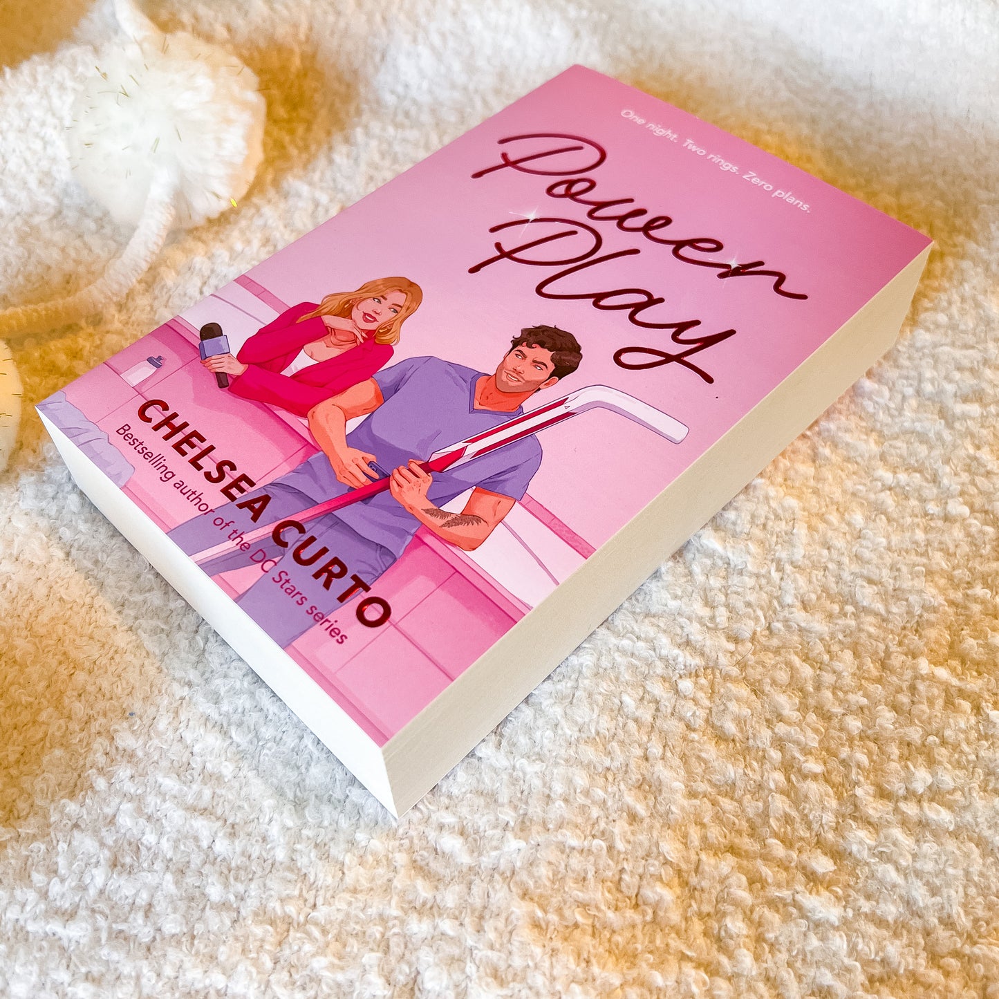 Book titled 'Power Play' by Chelsea Curto on a textured surface