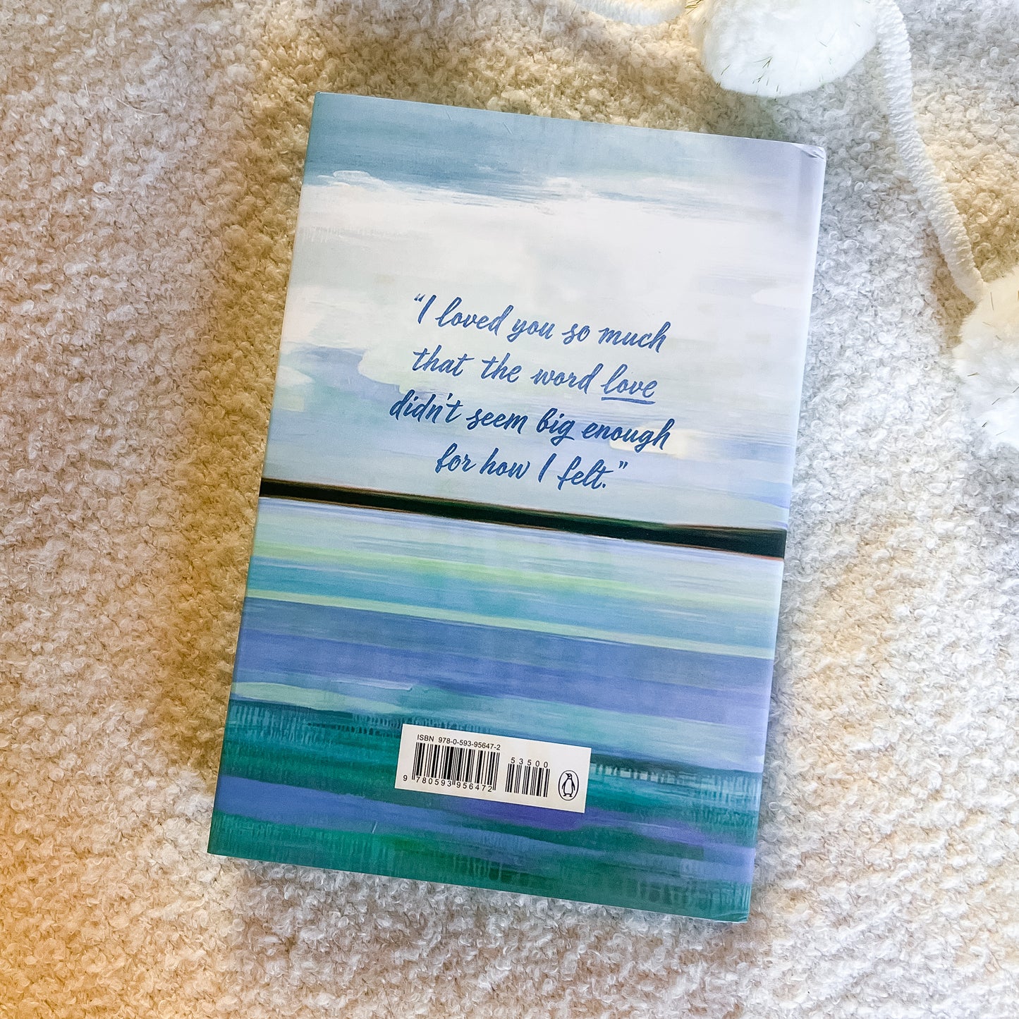 Book with a quote on a textured surface