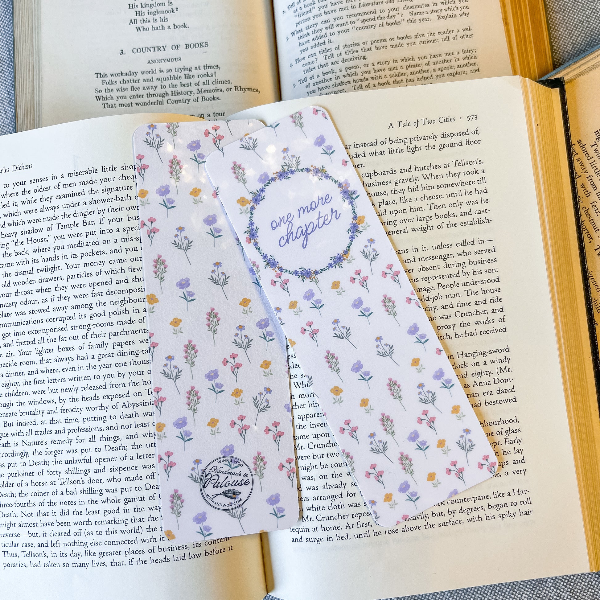 Floral bookmark on an open book with visible text