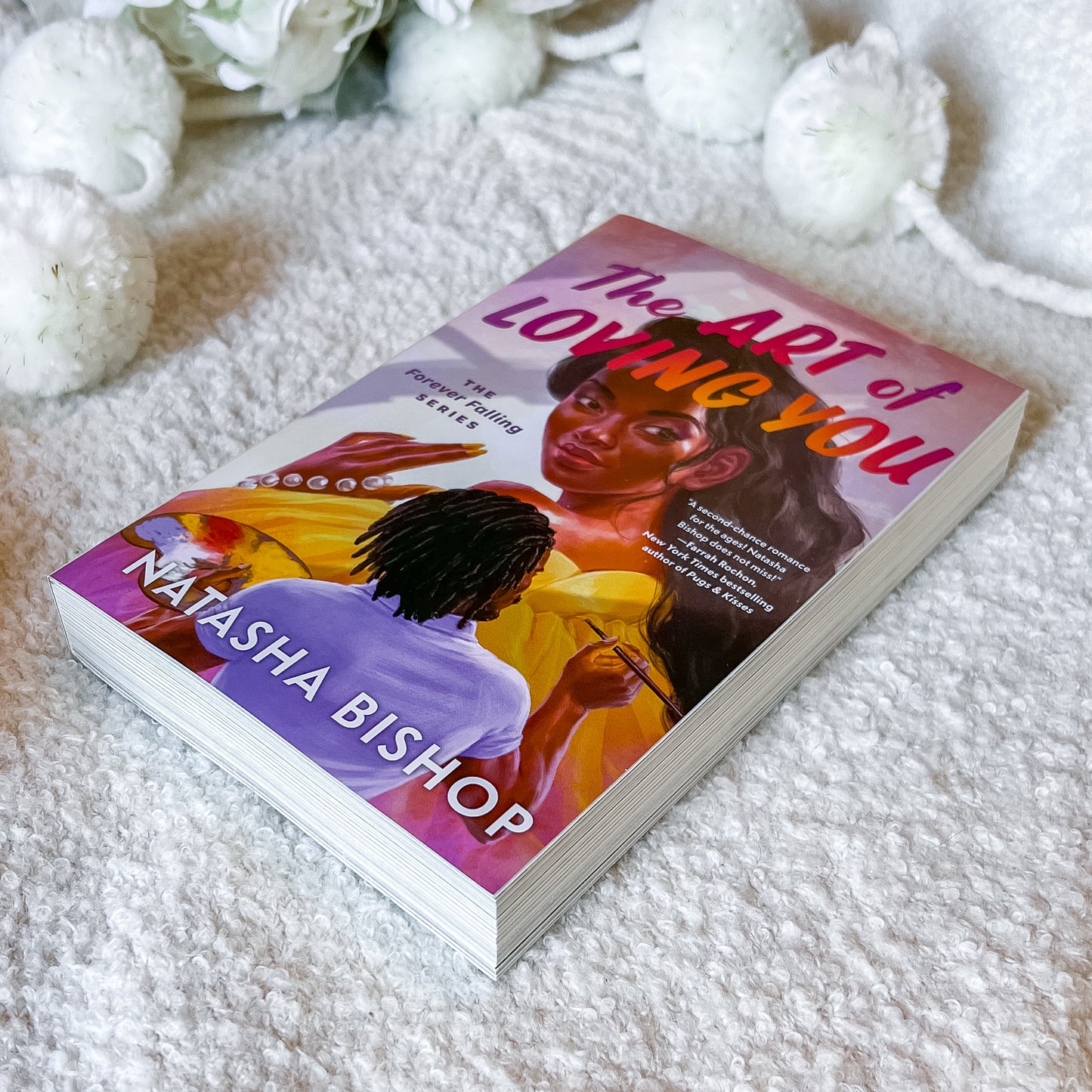 Book "the art of loving you" by Natasha Bishop on a light textured background.