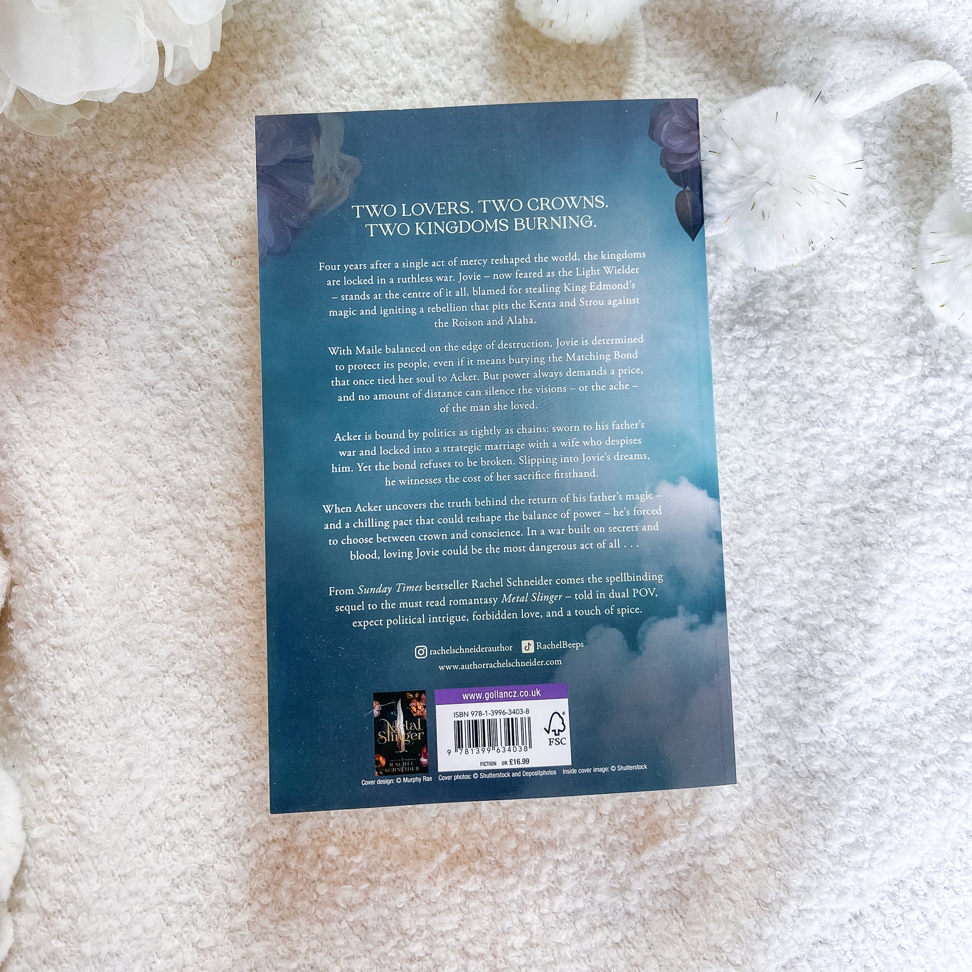 The back cover of the book, displayed flat on a textured white fabric background.